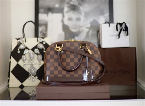louis vuitton alma bb review